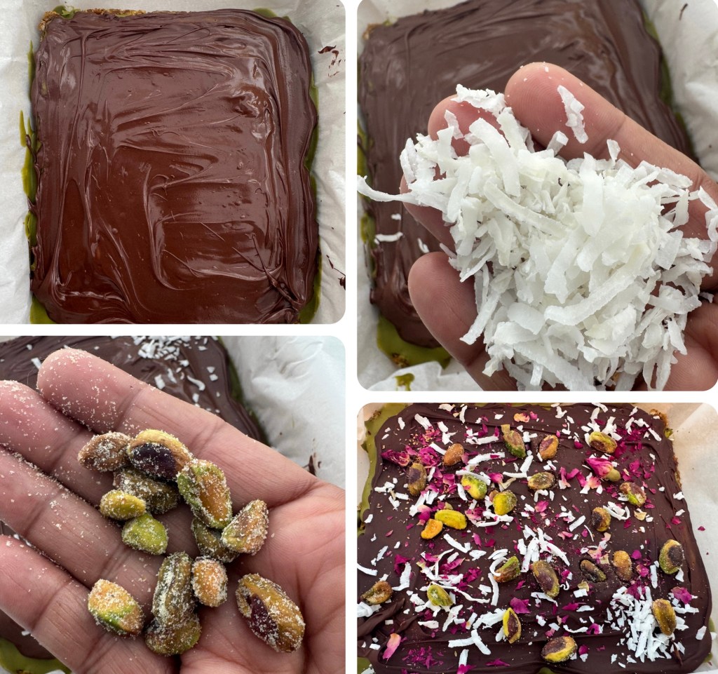 A hand holding shredded coconut above a chocolate layer in a dish.