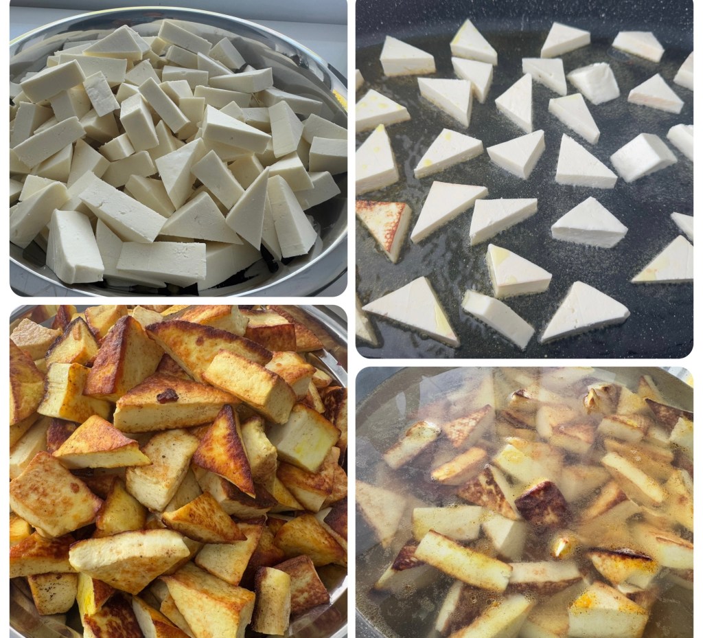 Raw paneer cubes arranged on a plate.